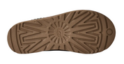 Brown shoe sole with tread pattern on a white background