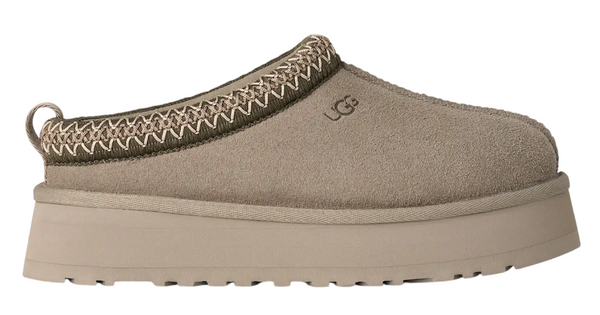 Beige slip-on shoe with platform sole on a white background