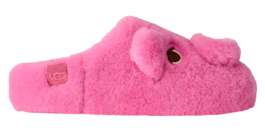 Pink fuzzy slipper with a bow on a white background