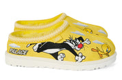 Yellow slippers with cartoon characters and 'Palace' branding on a white background