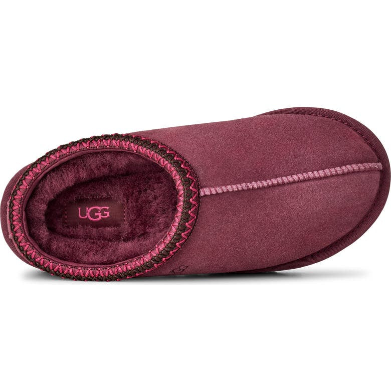 Maroon UGG slipper on a white background