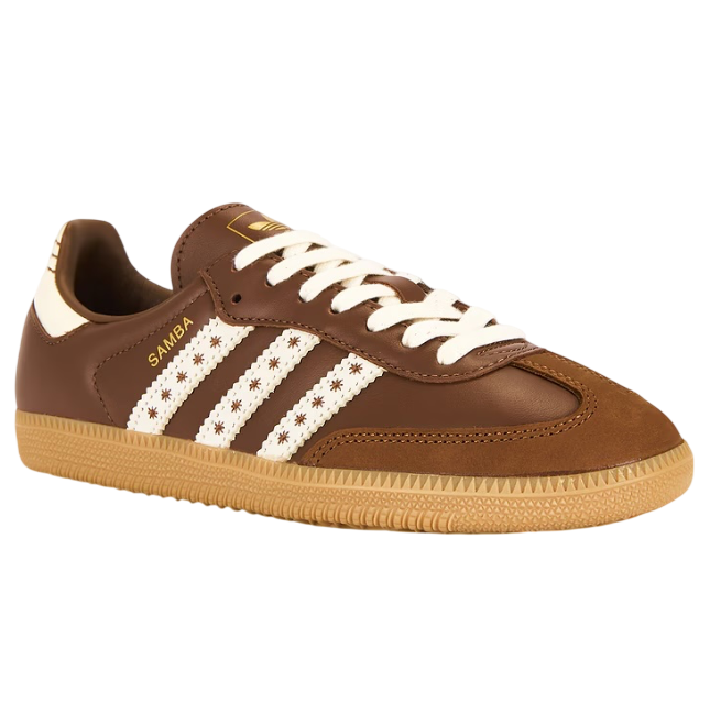 Brown Adidas sneaker with white stripes on a white background