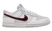 White sneaker with a maroon swoosh logo on a white background
