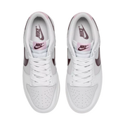 White sneakers with pink accents on a white background
