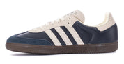 Navy and white sneaker with three stripes on a white background
