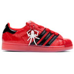 Red and black sneaker with a spider design on a white background - Image 1