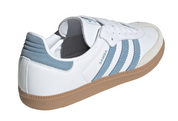 White sneaker with blue stripes on a white background