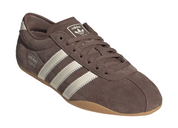Brown Adidas sneaker with three white stripes on a white background