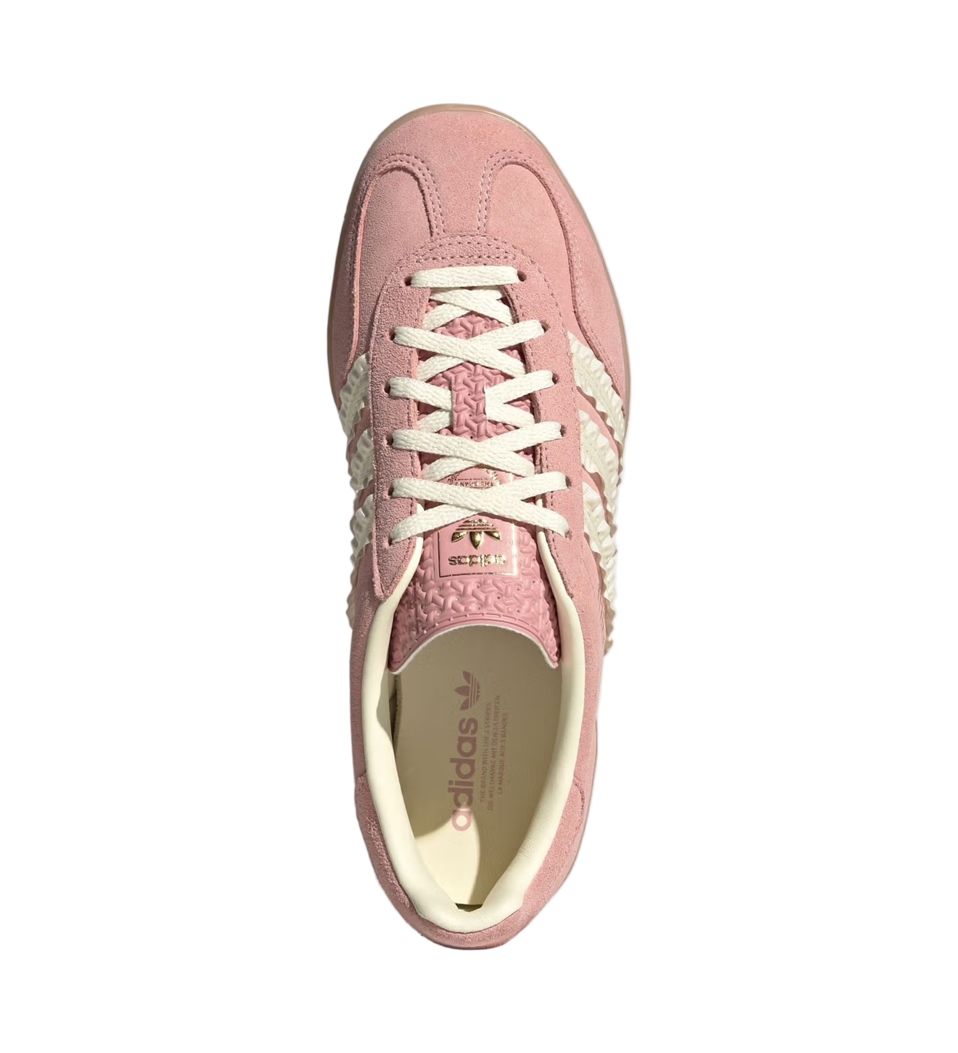 Pink sneaker with white laces on a light gray background