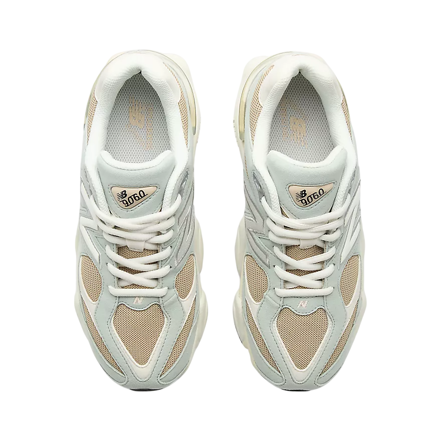 Pair of white sneakers with heart patterns on a white background